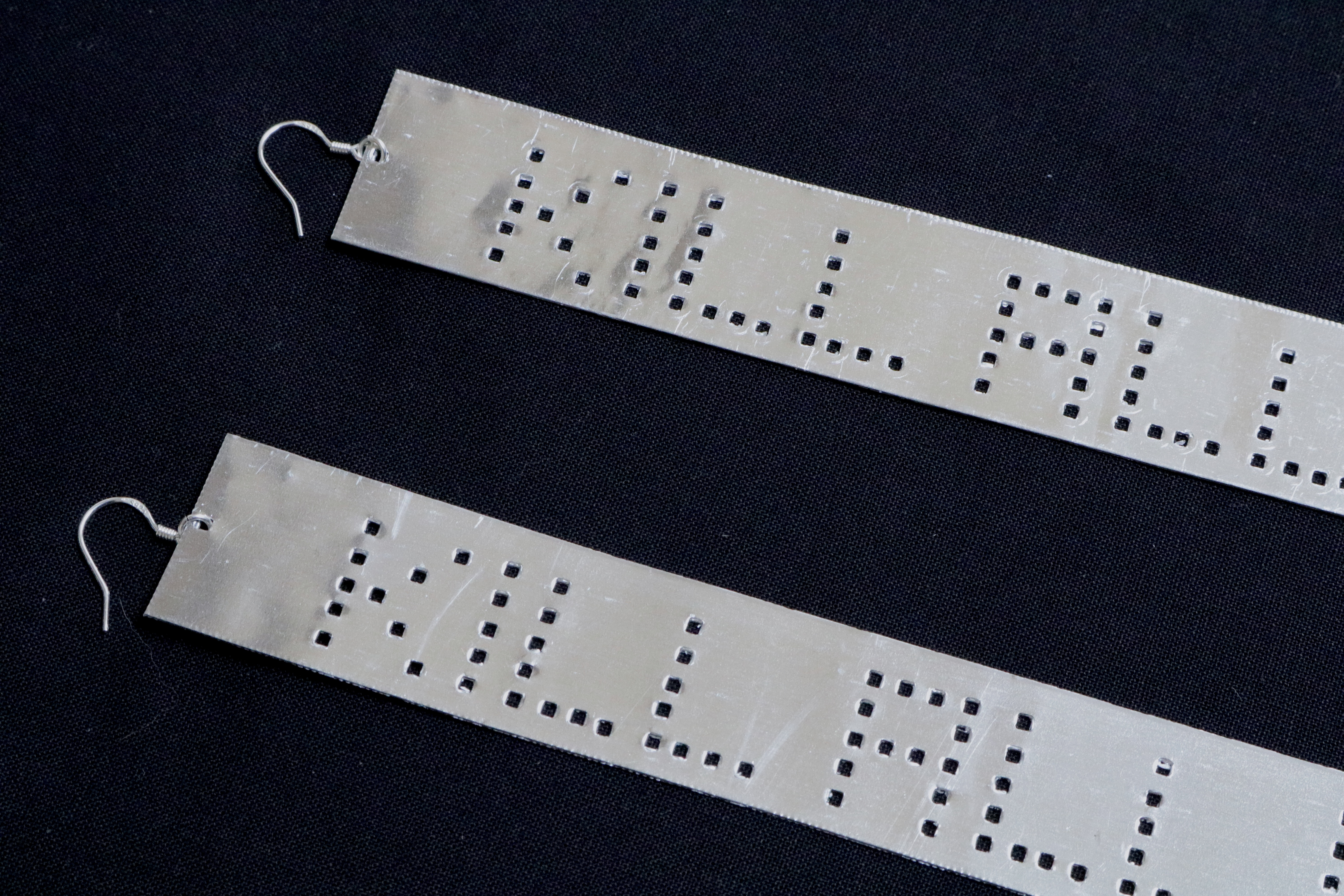 KILL ALL HUMANS — detail of perforated lettering